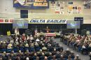 Pastor Brian White of Harvest Church starting the funeral service at Delta High School.