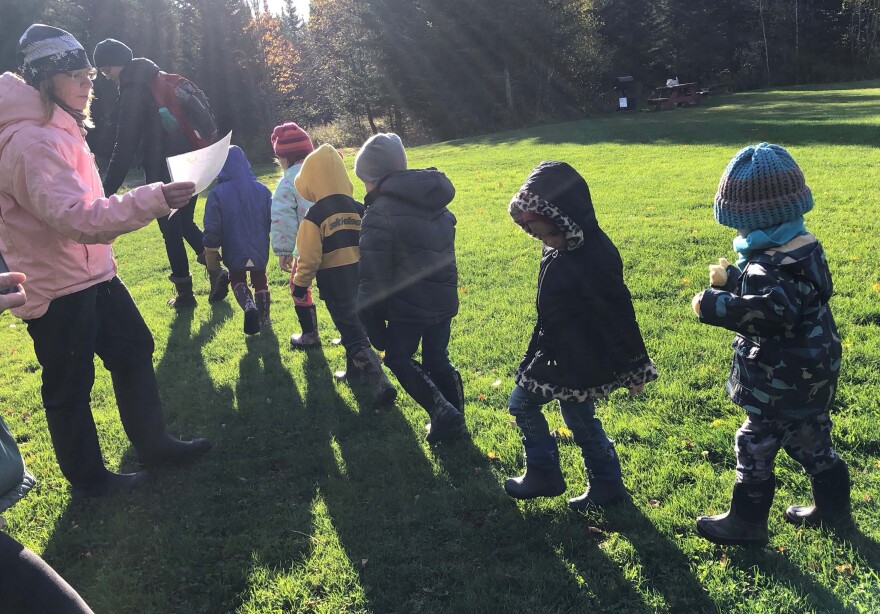 Preschoolers from Coventry march into the woods for their first Forest Day in the NEK activity.