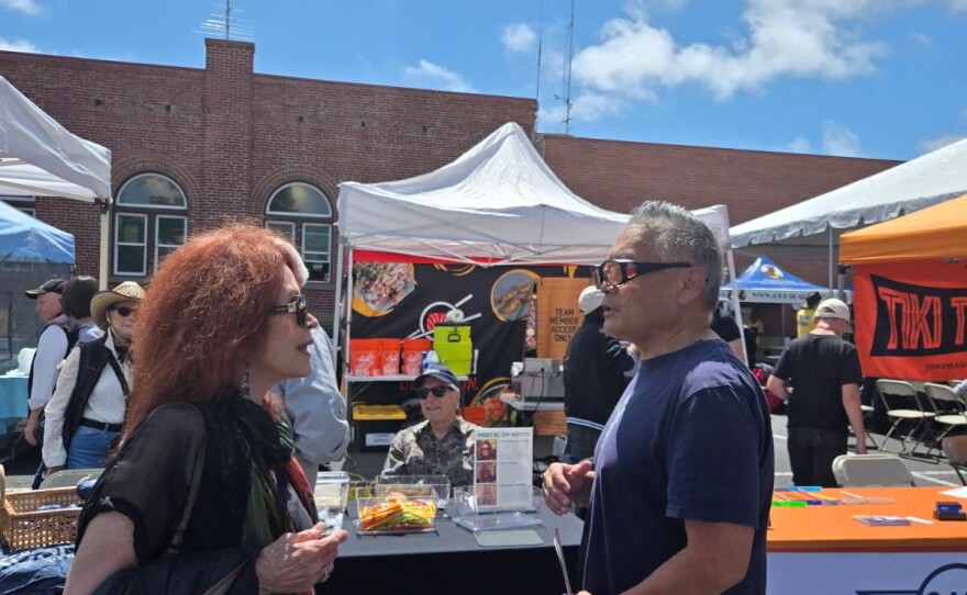 Kathleen Lawton with a festival attendee