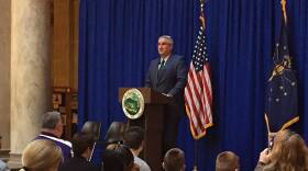 Gov. Eric Holcomb speaks to foster families at the Statehouse.