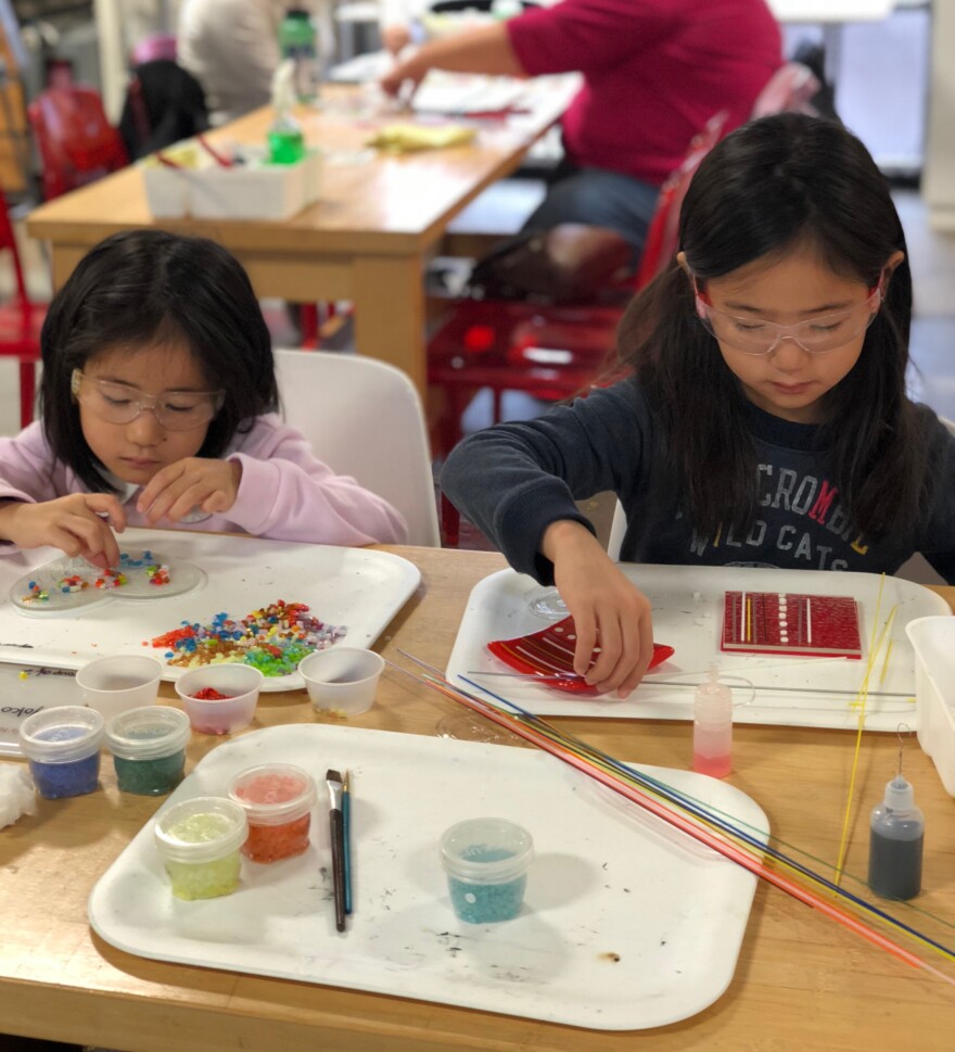 Students working in Brazee Street's glass studio.
