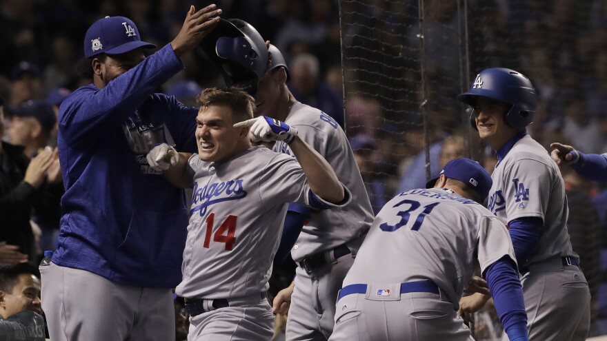 Los Angeles Dodgers' Enrique Hernandez his grand slam in Game 5 of the National League Championship Series against the Chicago Cubs on Thursday in Chicago.