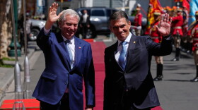 Bolivian President Rodrigo Paz, right, and Chile's President Jose Antonio Kast wave outside at the government palace in La Paz, Bolivia, Friday, Oct. 16, 2026. (AP Photo/Juan Karita)