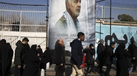Mourners walk back from a funeral ceremony for Iranian Gen. Qassem Soleimani in front of the former U.S. Embassy, who was killed with others in Iraq by a Friday U.S. drone attack, Monday, Jan. 6, 2020. (Vahid Salemi/AP)