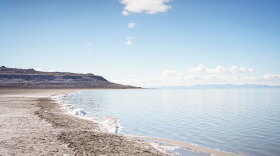  The shoreline of the Great Salt Lake has expanded as its water levels have receded over the years. Poet Nan Seymour has made a point to take a daily walk to the lake from her campsite while keeping vigil on Antelope Island.