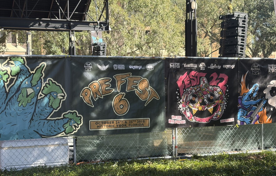 Banners from previous years of The Fest 24 are decorated along a fence in Bo Diddley Plaza on Thursday, Oct. 22, 2026. (Seth Haber/WUFT News)