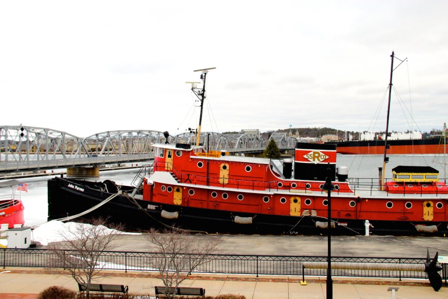 fully restored circa-1916 jug boat John Purvis on the docks at Door County Maritime Museum