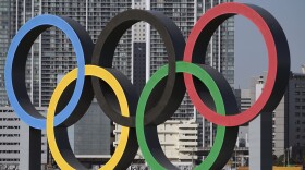 FILE - The Olympic rings are reinstalled after being taken down for maintenance ahead of the postponed Tokyo 2020 Olympics in the Odaiba section in Tokyo, Dec. 1, 2024. (AP Photo/Eugene Hoshiko, File)