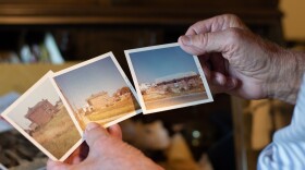 Dr. Wayne Weaver hold photographs documenting the construction of his family practice in Weyers Cave, which opened in 1974.