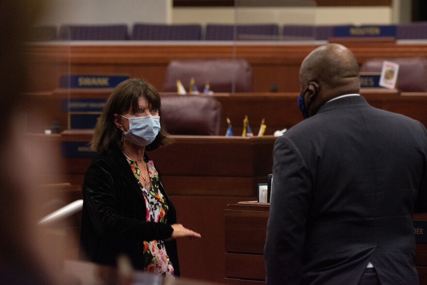 Assembly Minority Leader Robin Titus speaks with Speaker Jason Frierson.