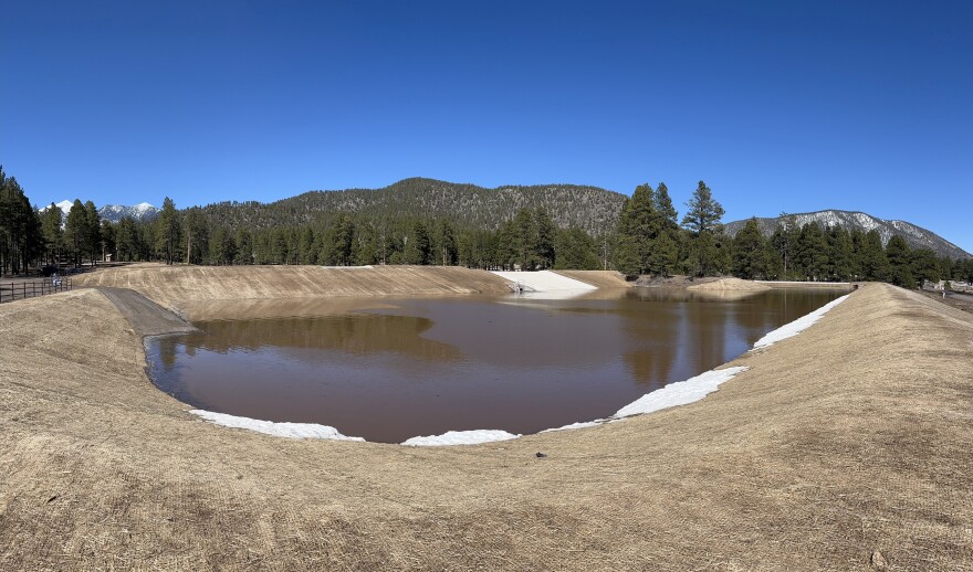 The Schultz Creek detention basins were built in the summer of 2022 to reduce the threat of post-wildfire flooding. The lowest basin is seen here on April 10, 2023. Official say the basins have reached 100% capacity because of runoff from snowmelt.