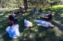 Dr Susan Abookire begins the forest therapy session asking residents and medical student to relax in any way they wish. (Jesse Costa/WBUR)