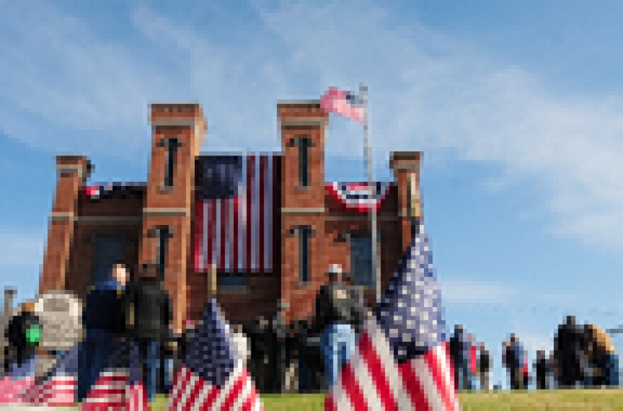 Spectators mill around the front lawn before the grand reopening of The Kentucky History Military Museum at the State Arsenal Friday afternoon.