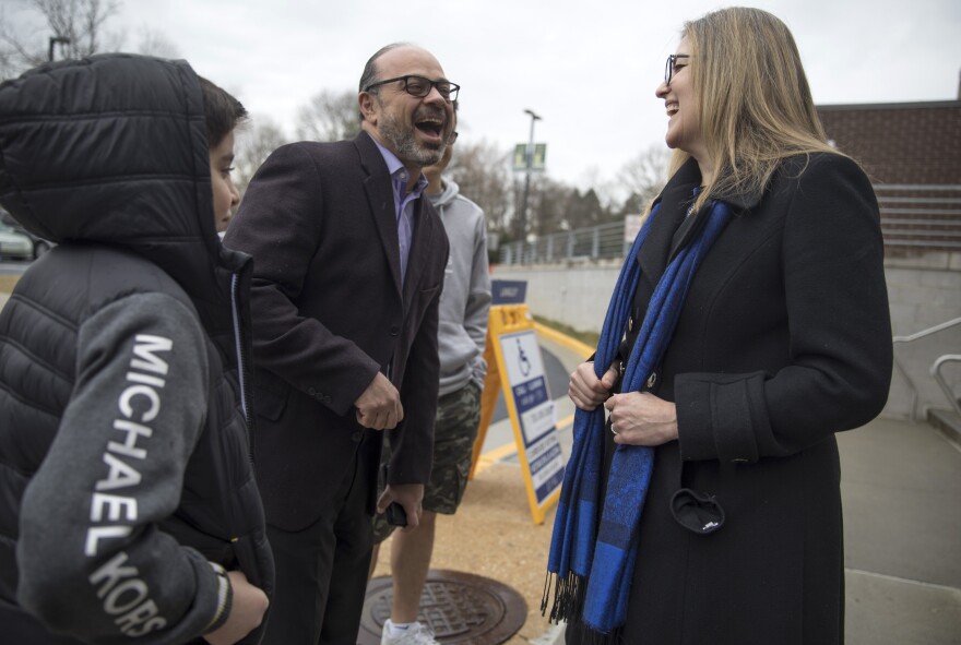 Rep. Jennifer Wexton, D-Va., greets voters outside Langley High School in McLean, Va. She endorsed Joe Biden.