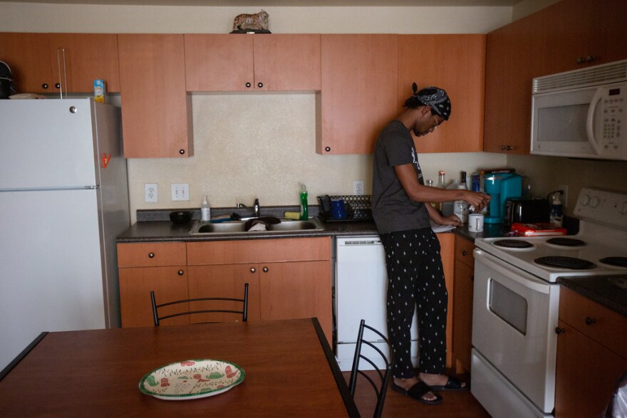 UT Austin student Malik Julien in his kitchen at Town Lake Apartments.