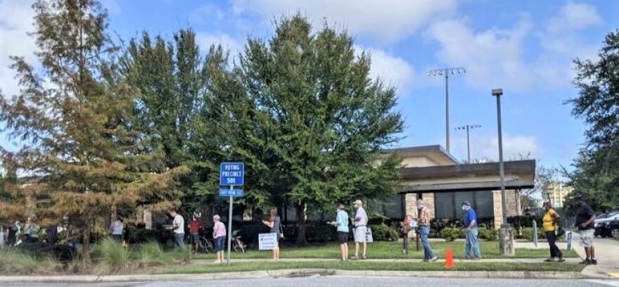 Voters line up on Oct. 19 to cast their ballots at the San Marco Branch of the Jacksonville Public Library.