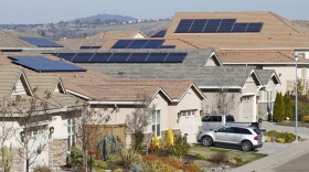 This photo taken Wednesday, Feb. 12, 2020, shows solar panels on rooftops of a housing development in Folsom, Calif. State regulators at the California Public Utilities Commission are expected to propose reforms that would lower the financial incentives for homeowners who install solar panels. (AP Photo/Rich Pedroncelli, File)