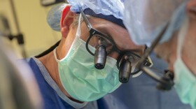 This photo provided by DukeHealth shows surgeon Joseph Turek during pediatric heart surgery in Durham, N.C., in 2021