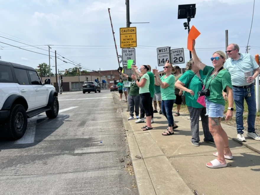 Choate employees and community members hold a rally in downtown Anna after the Illinois Department of Human Services announced layoffs and a reduction of services.