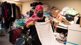 Oklahoma City resident Bobbi Elkamely folded and sorted clothing donated to refugees from Afghanistan who are resettling in Oklahoma at the Council on American-Islamic Relations on Oct. 13, 2021. Elkamely said she and her children have faced ridicule because they are Muslim, which spurred her to do something to help the Afghan families coming to Oklahoma.