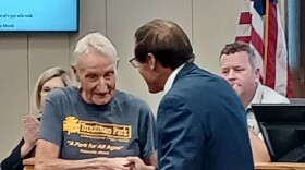 Dean Troutman, right, receives a proclamation from Peoria County Board member Brian Elsasser at their Sept. 14, 2023 meeting.