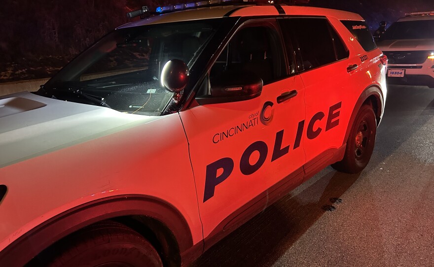 A cruiser for the Cincinnati Police Department patrols near downtown Cincinnati.