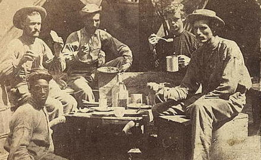 <strong>At Least They Had Real Coffee: </strong>Union soldiers eat and drink in front of tents.