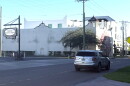 a silver SUV drives south down south howard avenue in front of bern's steak house