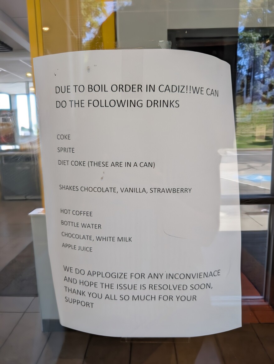 A sign on a business door listing which beverages were available during a boil order in the village of Cadiz. 