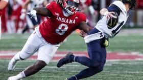 Indiana's CJ West chases after Michigan quarterback Davis Warren during a Nov. 9 game at Memorial Stadium.