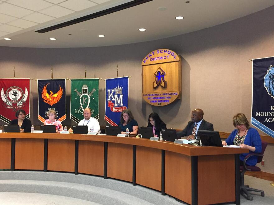 Kent School Board Directors Karen DeBruler (second from left), Ross Hardy (third from left), and Debbie Straus (fourth from left) say they will not run to retain their seats.