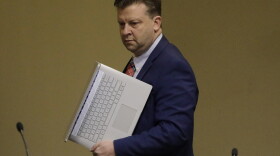 Republican state Sen. Todd Weiler carries his laptop in to a committee hearing on, Jan. 29, 2020, at the Utah State Capitol, in Salt Lake City.