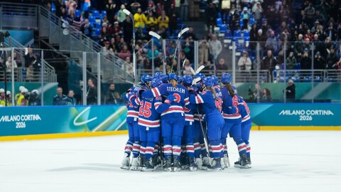 U.S. players celebrate after a semifinal match of women's ice hockey between the United States and Sweden at the 2026 Winter Olympics, in Milan, Italy, Monday, Feb. 16, 2026. (AP Photo/Petr David Josek)