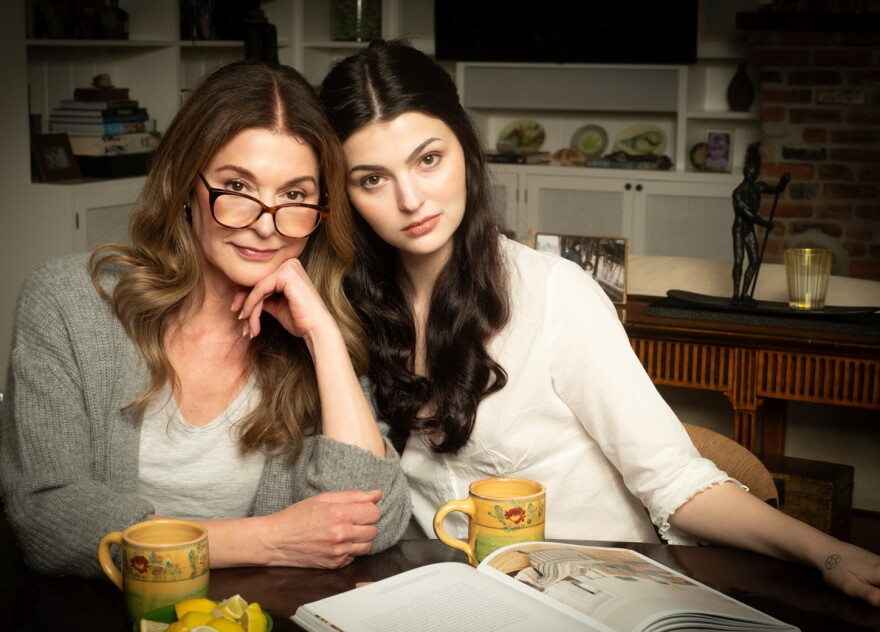 Jane Leeves and Isabella Kathryn Coben sit together at a table with coffee mugs in front of them