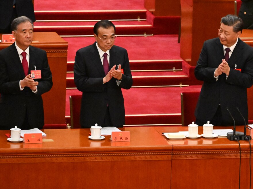 Former Premier Li Keqiang (center) died in 2023. At the end of that year, a series of obituaries produced by Caixin Media, one of China's most respected news outlets, disappeared from its website. They included articles honoring Li and other figures who had passed away that year.