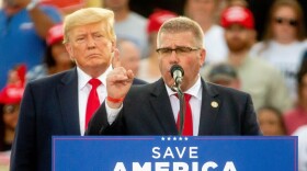 Illinois State Rep. Darren Bailey, R-Xenia, speaks next to former President Donald Trump, who endorsed Bailey for Illinois’ Gubernatorial race, on Saturday, June 25, 2022, during a rally at the Adams County Fairgrounds in Mendon, Ill.