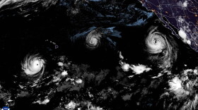 A satellite image shows from left to right, Hurricane Lowell, Hurricane Karina and Hurricane Marie in the Pacific on Friday night.