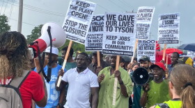 Laid-off Tyson Foods workers protest the beef processing plant closure in the rain on Friday, Aug. 21, 2026.