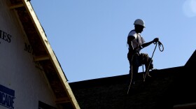 File photo of a construction worker on a rooftop as the sun beats down in Chapel Hill, N.C. on Tuesday, July 6, 2010. After an extended Fourth of July weekend when temperatures inched into at least the 90s from Maine to Texas and into the Southwest and Death Valley, the mid-Atlantic embarked on a string of intensely hot days, with temperatures in some places closing in on 100-plus degrees.