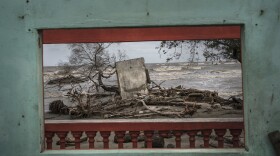 A window frames a portion of the shore littered with debris left from flooding driven by a Gulf of Mexico sea-level rise, in the coastal community of El Bosque, in the state of Tabasco, Mexico, Wednesday, Nov. 29, 2023. 