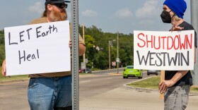 Protestors gather at a busy intersection in the southwest Oklahoma city of Lawton on July 17, 2025. They are united in their fight against a nickel refinery in town called Westwin Elements.