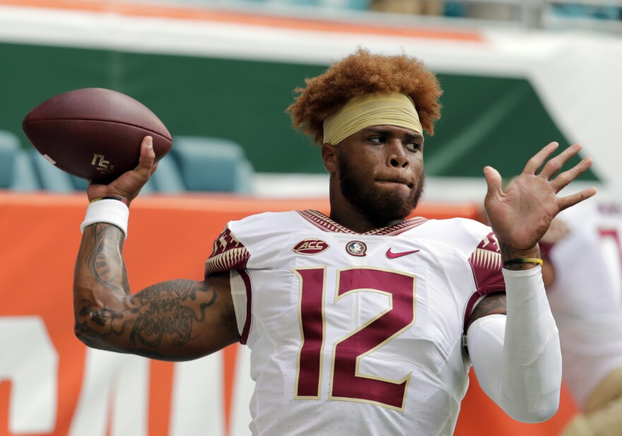Florida State quarterback Deondre Francois (12) warms up before an NCAA college football game against Miami, Saturday, Oct. 6, 2018, in Miami Gardens, Fla. 