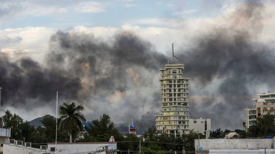 Smoke from burning cars rises in Culiacán, Mexico, on Thursday, after an intense gunfight between security forces and gunmen linked to the Sinaloa drug cartel.