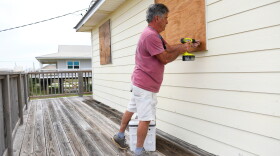 Larry Smith boards up his home with plywood ahead of Hurricane Isaias' expected landfall along the Gulf Coast in Dauphin Island, Alabama, Thursday, Oct. 8, 2026. (AP Photo/Octavio Jones)