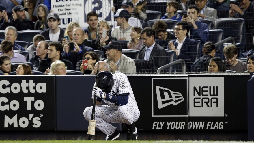 Jeter waits to bat in the first inning.
