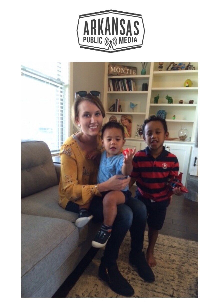 Michaela Montie sits with her two adopted Marshallese sons inside their Roger's home. Montie is founder and executive director of Shared Beginnings, a nonprofit group that serves expectant moms wishing to protect their baby's future through adoption, including Marshallese birth mothers.