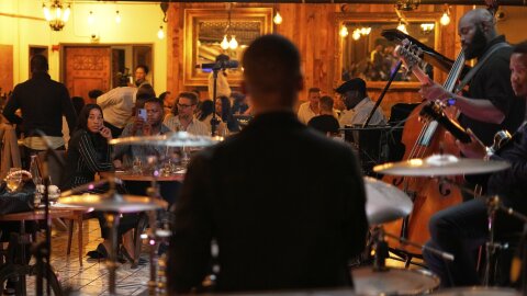 From cozy, red-velvet rooms to vibrant underground spaces, Jazz24 listeners shared their favorite local spots to catch live music around the world.