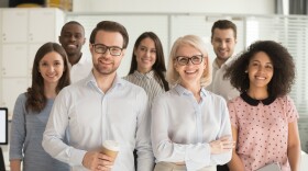 A team of smiling professionals; members of Florida's public employee unions have long been able to choose automatic payroll deduction for their union dues 