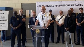 JFRD Fire Chief Keith Powers speaks at Fire Station 63 on April 28, 2022, flanked from left to right by City Council President Sam Newby, Mayor Lenny Curry, and City Council Vice-President Terrance Freeman.