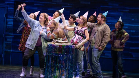 A group of party goers taking a selfie.